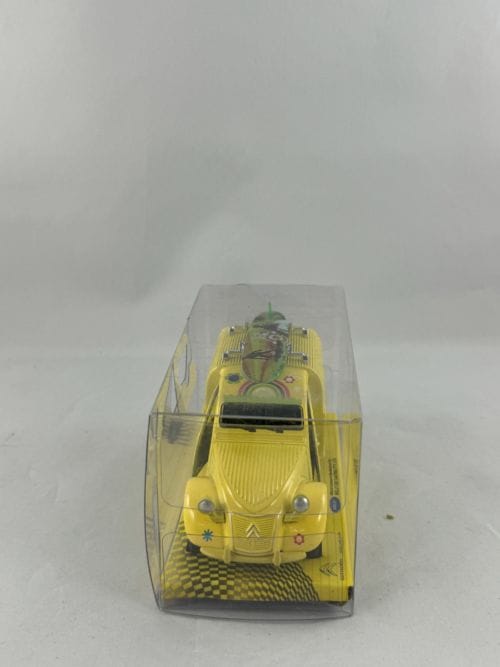 Fourgonnette 2CV Citroën jaune hippie planche de surf verte