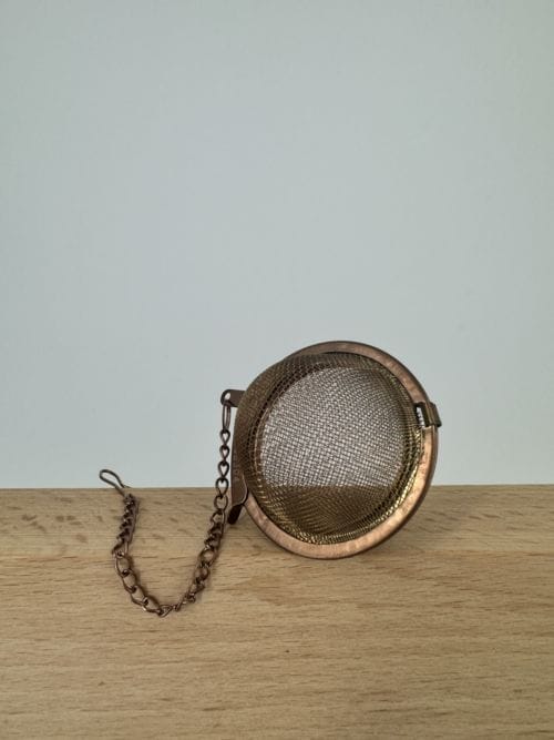 Infuseur de thé avec chaine en inox couleur Bronze