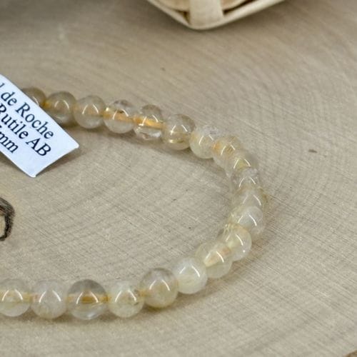Bracelet Boule 06 mm cristal de roche inclusion rutile AB